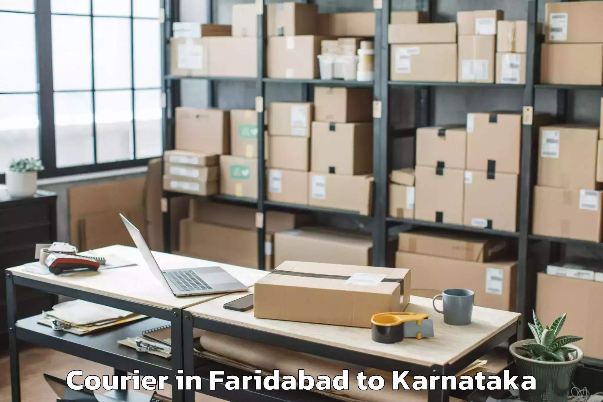 Faridabad to Karnataka State Law University Courier Booking